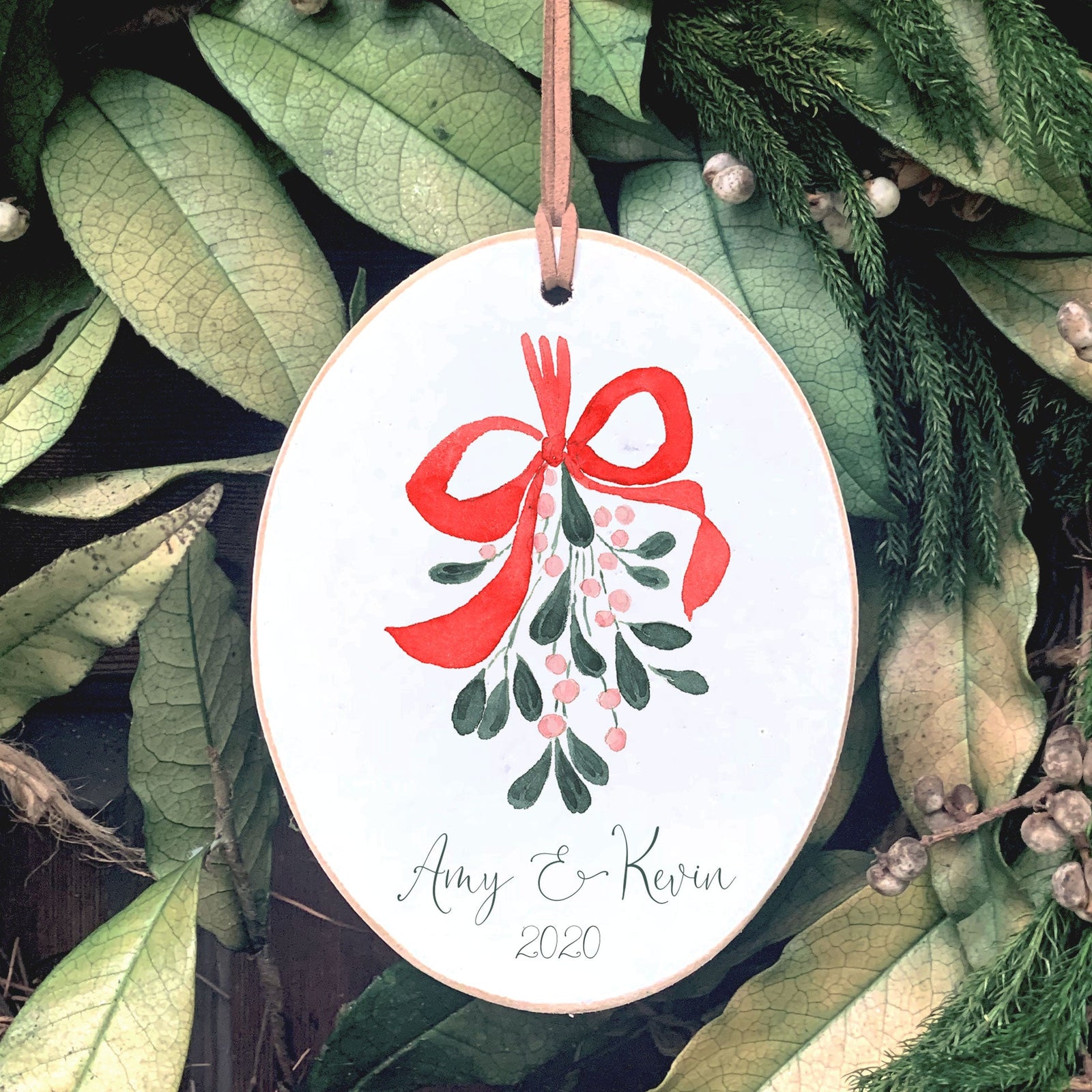 Front View. Customizable Ornament | Mistletoe Watercolor Wood Ornaments The WAREHOUSE Studio Name & Year