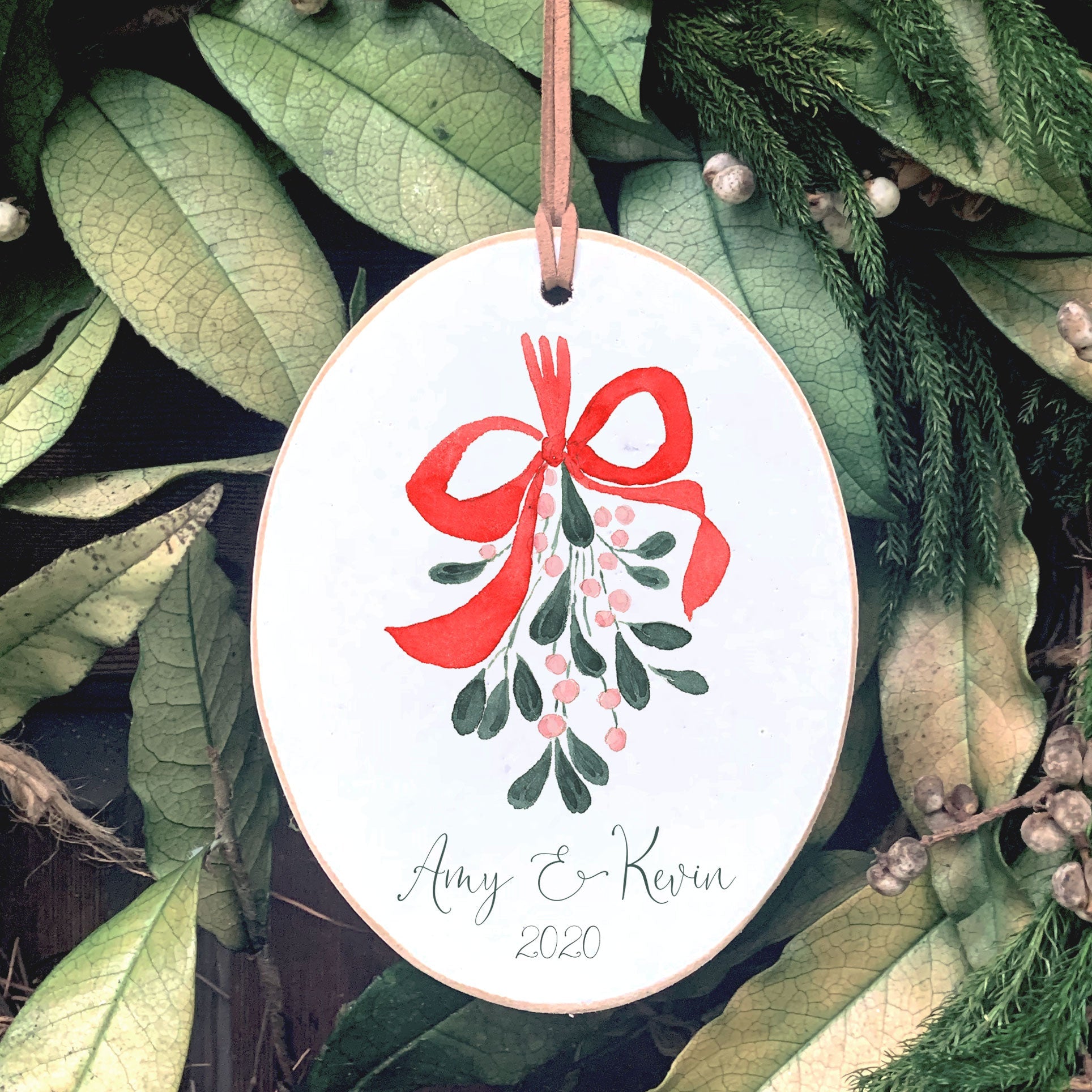 Front View. Customizable Ornament | Mistletoe Watercolor Wood Ornaments The WAREHOUSE Studio Name & Year 